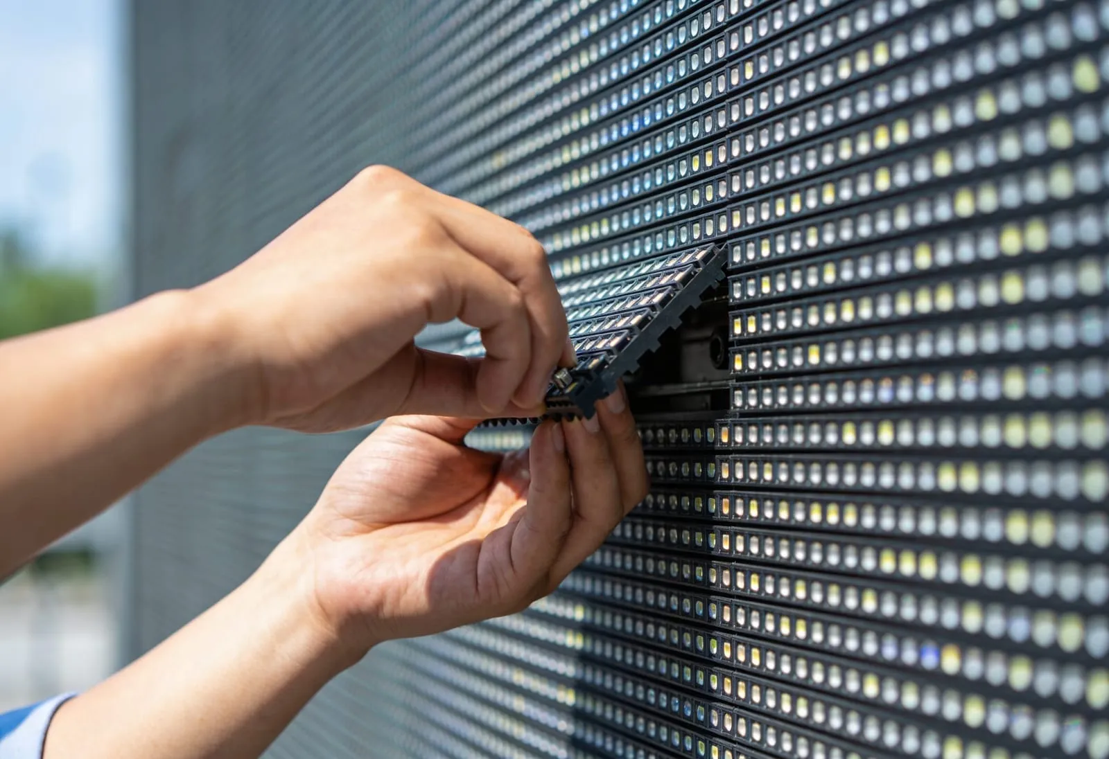 digital display signs installation by technician in bucket truck