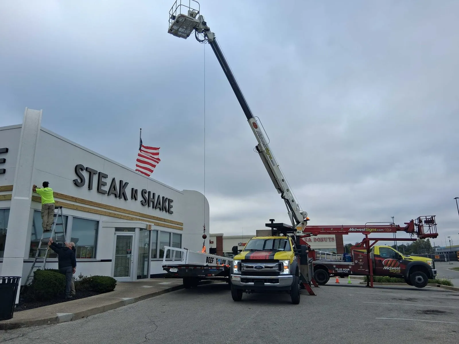 Midwest Signs crew installing a new drive-thru canopy at Steak 'n Shake