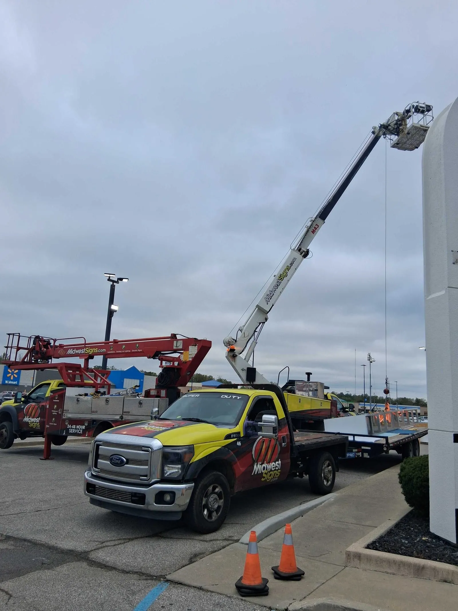 Midwest Signs crane lifting a canopy structure at Steak 'n Shake in Indianapolis