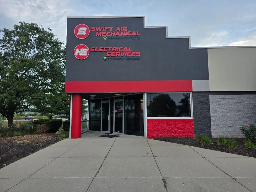 Swift Air Mechanical and H.E. Electrical Services entrance signage on drivit fascia